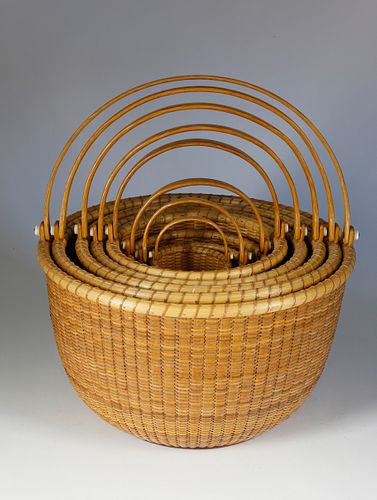 Nest of Eight Bill and Judy Sayle Round Open Swing Handle Nantucket Baskets, 1983