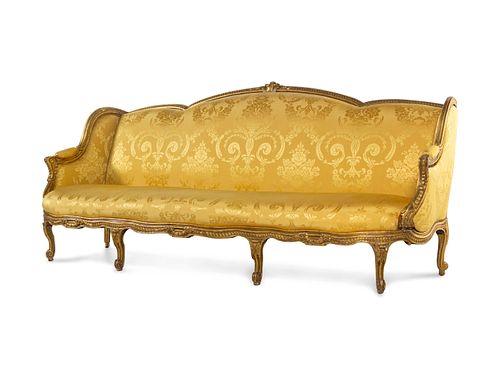 A Louis XV Style Carved Giltwood Sofa