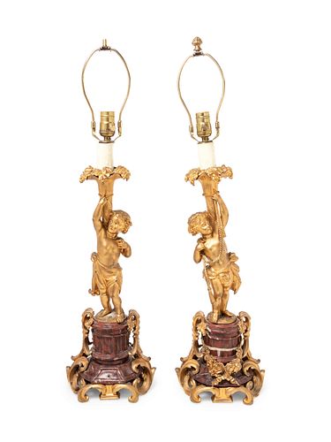 A Pair of Louis XV Style Gilt Bronze Figural Candlesticks 