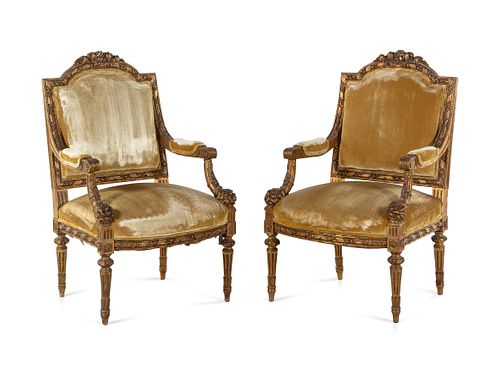 A Pair of Louis XVI Carved Giltwood Fauteuils