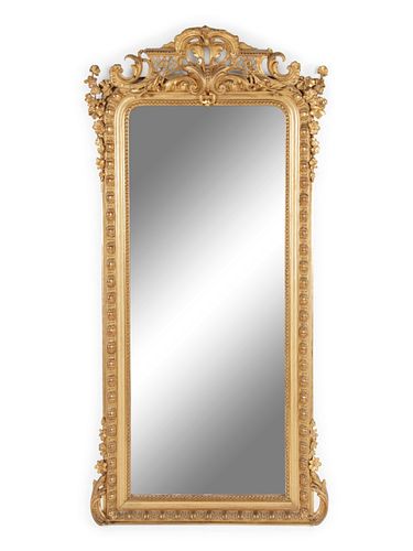 A Louis XVI Style Carved Giltwood Pier Mirror