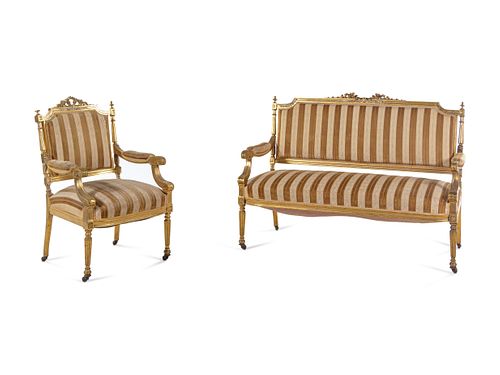 A Louis XVI Style Carved Giltwood Settee and Fauteuil