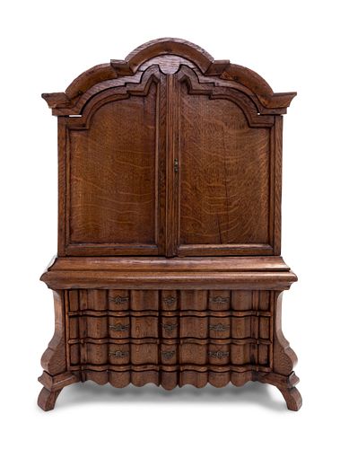 A Continental Oak Diminutive Cabinet