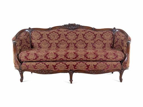 A Rococo Revival Carved Walnut Sofa