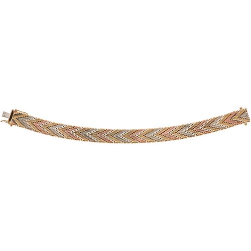Bracelet in 14k yellow, white, and pink gold. Weight: 37.4 g. Length: 7"