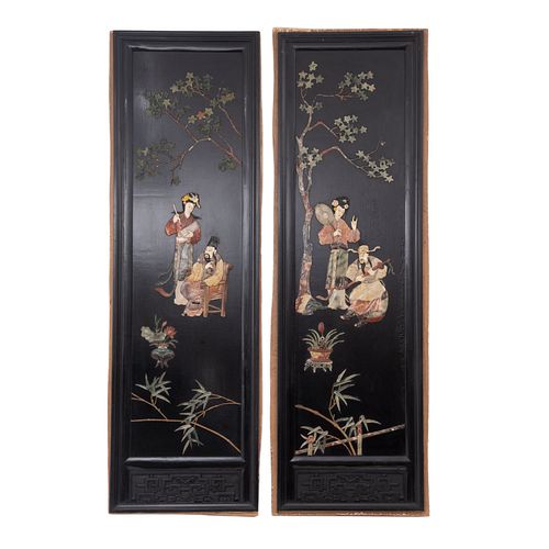Pair of panels. 20th century. Made of carved wood ebonized with soapstone applications in double view. Pieces: 2