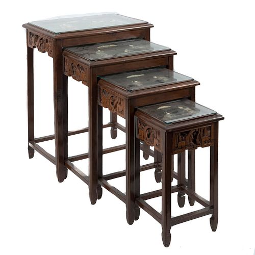 Set of 4 nesting tables. Chinese style. 20th century. Carved, openwork wood, with applications in resin and polychromy.
