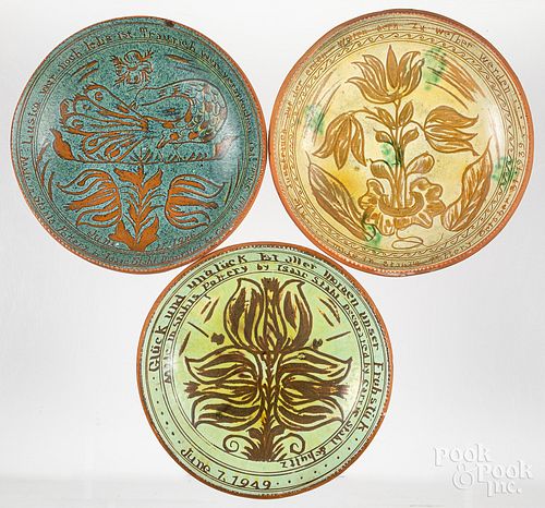 Three Stahl sgraffito decorated redware plates