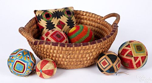 Seven Pennsylvania sewing balls and basket