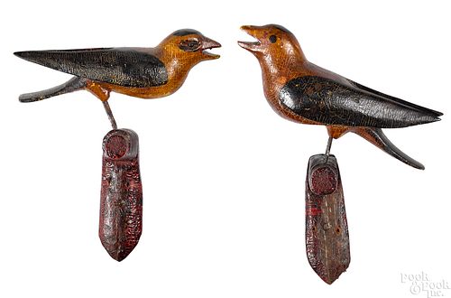 Pair of carved and painted song birds on perches