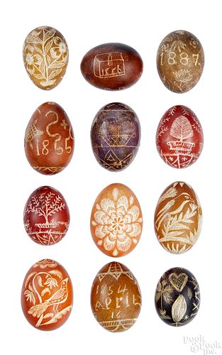 Twelve Pennsylvania pin carved chicken eggs