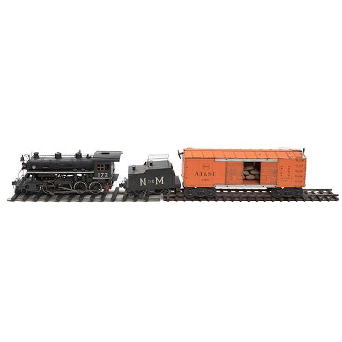 Miniature train set. North American origin. 20th century. In wood and metal. Consists of: locomotive, container and wagon. Includes tracks.
