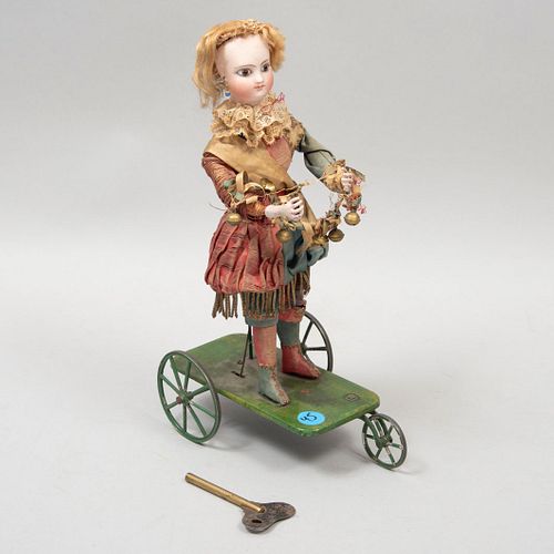 Jester. Paris, France. ca.1910. Made in porcelain and fabric. Wheel supports.