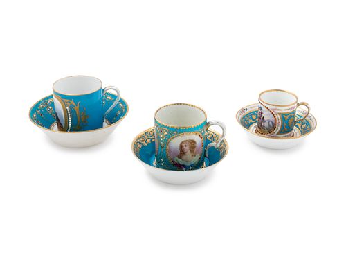 Three Sevres Painted, Parcel Gilt and "Jeweled" Celeste Blue-Ground Porcelain Teacups and Saucers