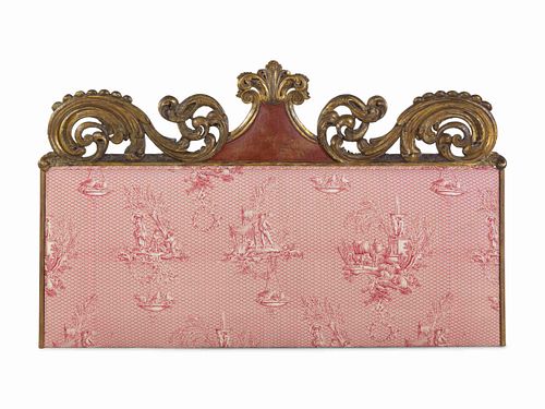A Continental Carved and Parcel Gilt Wood Upholstered Headboard