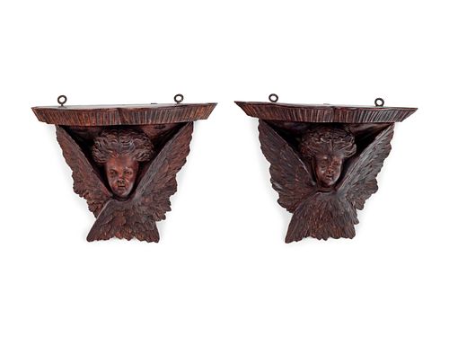 A Pair of Continental Carved Oak Brackets