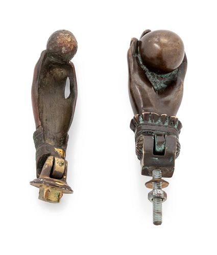 A Pair of Bronze Hand-and-Ball Door Knockers