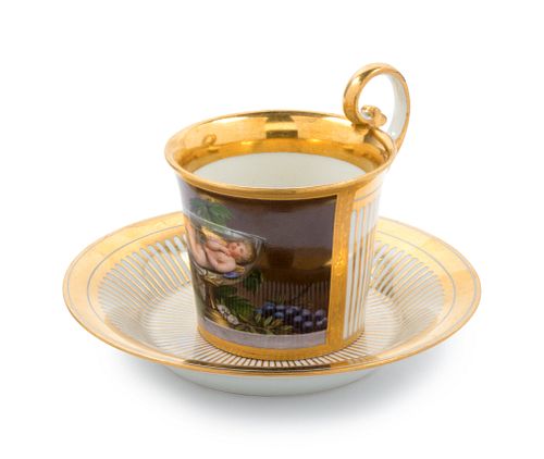 A Vienna Painted and Parcel Gilt Porcelain Teacup and Saucer