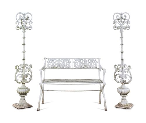 A White Painted Iron Garden Bench and a Pair of Torcheres