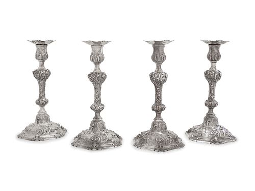 A Set of Four Rococo Revival Silver Candlesticks