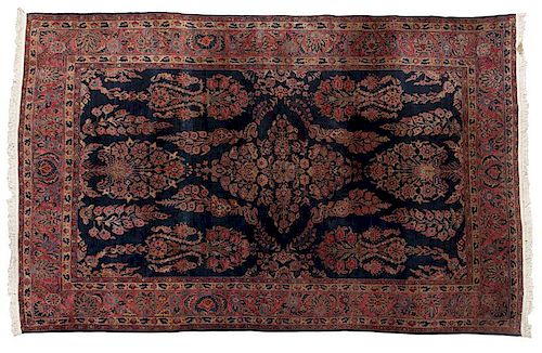 A Persian Sarouk woolen rug