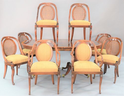 Nine piece mahogany dining room set to include oval banded, inlaid table, 2 arm chairs, 6 side chairs, all with caned back and goosehead supports, ht.