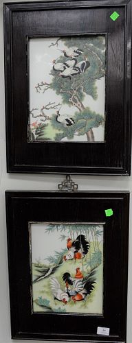 Two Chinese porcelain framed plaques, one having painted roosters and bamboo trees, the other with cranes in scrolling pine tree, sight size: 11 1/2" 
