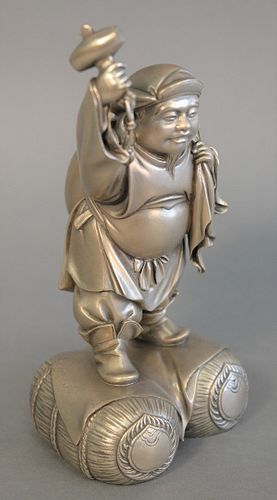 Large Japanese Meiji solid silver figure holding a hammer, ht. 8", 55.8 t.oz.