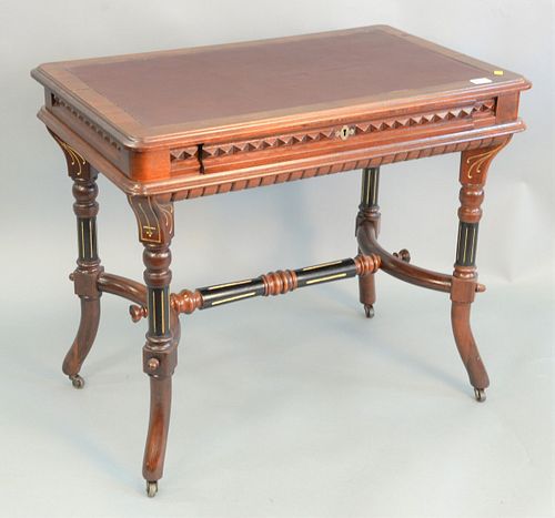 Eastlake writing table having tooled leather top, ht. 30 1/2", top 22" x 36".