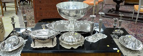 Thirteen piece group of silverplate to include set of 4 candlesticks, pair of candlesticks, pair covered vegetable dishes, revolving vegetable dish, 2