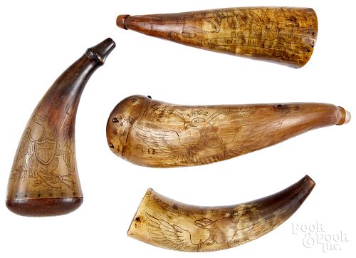 Four scrimshaw powder horns