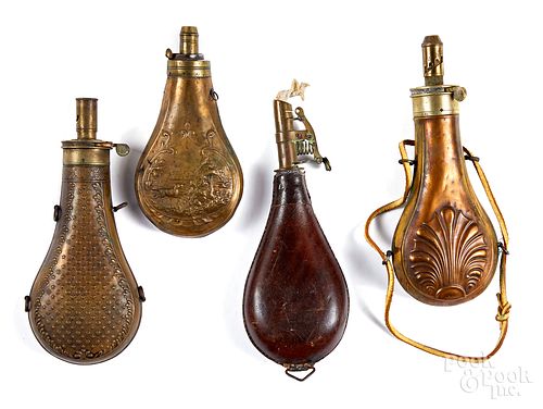 Three brass and copper powder flasks, 19th c.