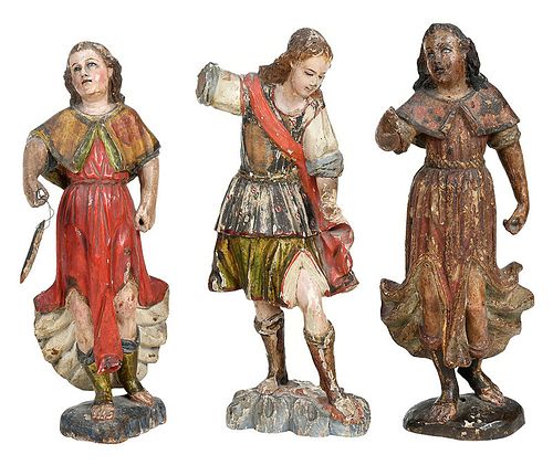 Three Carved and Polychromed Santos Figures