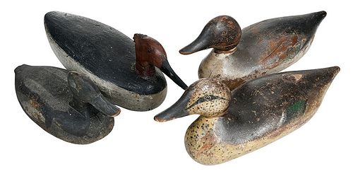 Four Solid Bodied Carved and Painted Decoys