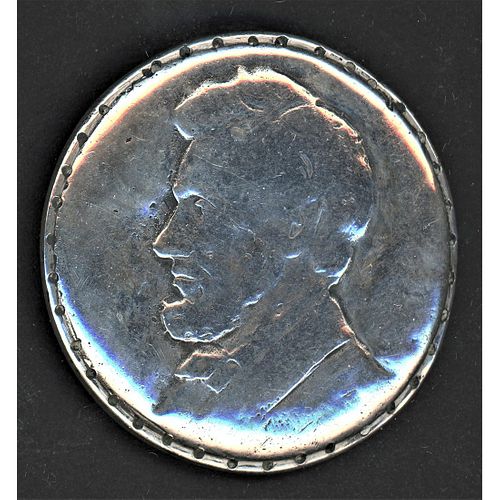 A LARGE MARKED STERLING SILVER LINCOLN HEAD