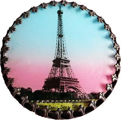 A TRANSFER DECORATED EIFFEL TOWER UNDER GLASS BUTTON