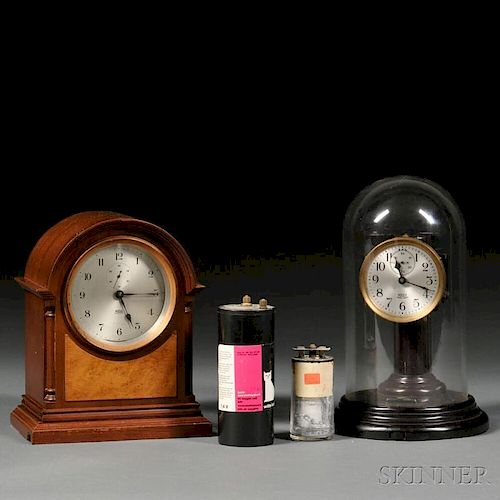 Two Poole Electric Clocks