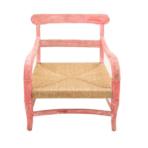 Armchair. 20th century. Carved in wood. Bamboo design in lacquered pink, woven palm seat.