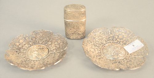 Three-piece reticulated silver lot to include two Chinese saucers, dia. 5 1/2" along with a container, 3 1/4" with a lid, 8.7 t.oz. .