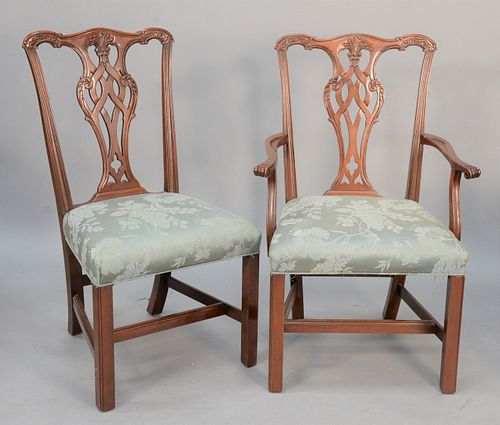 Set of twelve Chippendale-style dining chairs to include ten side and two arm.