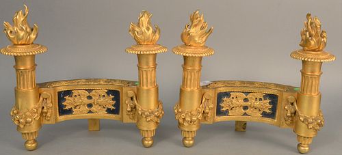 Pair of French bronze dore chenets having flaming torchiere ends, wreaths of flowers and fruit, ht. 12 1/2"., lg. 13".