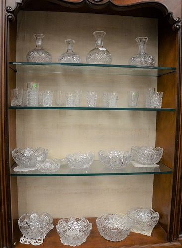 Large group of cut glass to include four vases, six round bowls, small dishes and bowls, cups, etc.