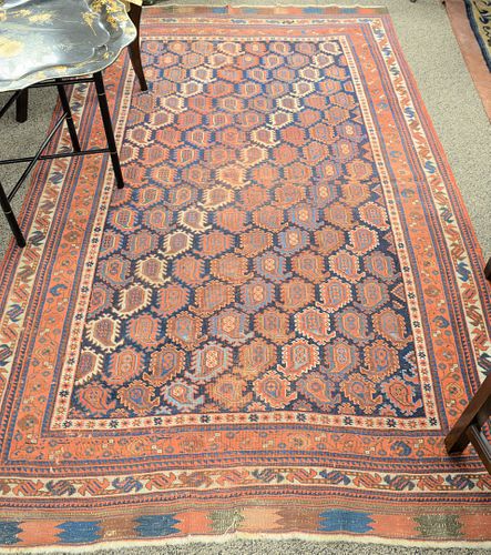 Oriental area rug, 4' 10" x 8', worn.