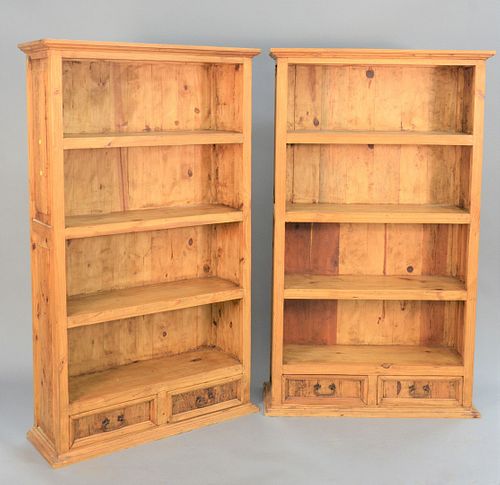 Pair of contemporary pine bookcases, each with two drawers, ht. 71", wd. 42".