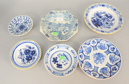 Six blue and white Delft plates, two having yellow rims, two with Oriental decoration, largest 9 1/4".