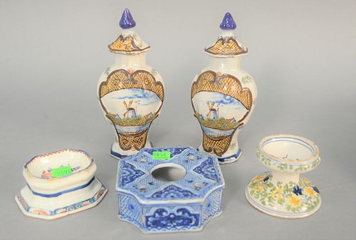 Five-piece Delft group, spool shaped salt, octagon salt, octagonal inkwell with quill holder and a pair of carved vases, ht. 7 1/4", decorated with wi