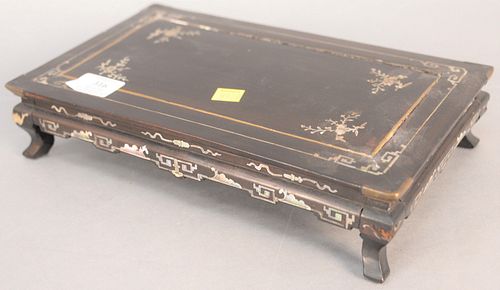 Small Chinese hardwood stand having mother of pearl inlay and brass cap corners, ht. 2 1/2", top 7 1/2" x 12 1/2". Provenance: The Estate of Ed Brenne