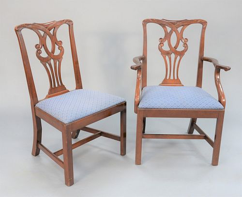 Set of twelve Chippendale-style mahogany dining chairs, two arm and ten side, all with slip upholstered seats.
