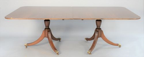 George III-style mahogany dining table with double pedestal base with ht. 29 1/2", leaves 22 1/2" each, open 48" x 140", top 48" x 90".