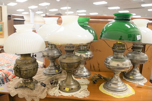 Six oil lamps to include two pairs of Rayo oil lamps with glass shades, two brass, tallest 19".